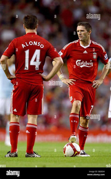 Liverpools Xabi Alonso And Robbie Keane During The Game Hi Res Stock