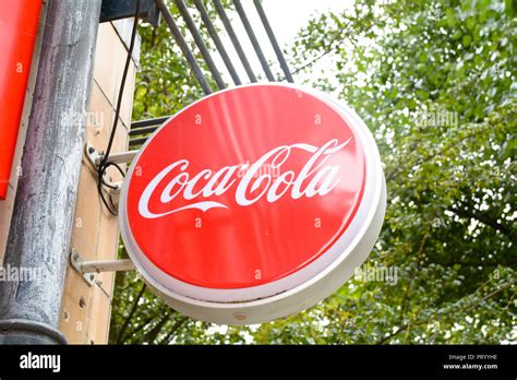 Coca-Cola signs on wall outside cafe Stock Photo - Alamy