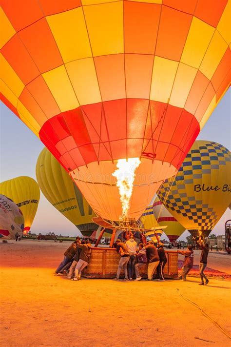 Hot Air Balloons Being Prepared For Tourist Rides At Sunrise In Luxor