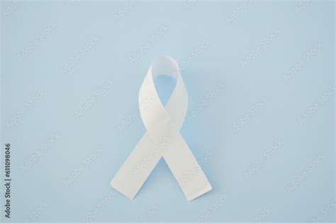 White Ribbon As A Symbol Of Peace On A Blue Background World Day Of