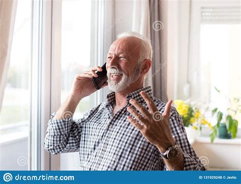 Elderly Man Talking On Phone A Home Stock Photo Image Of Living