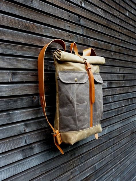 Image Of Waxed Canvas Backpack With Roll To Close Top And Leather