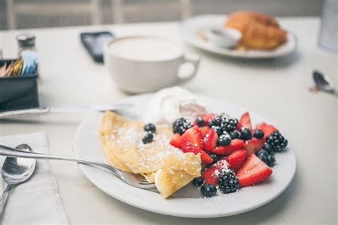 "Crepes With Berries." by Stocksy Contributor "RZCREATIVE" - Stocksy