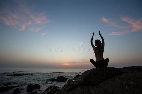 Silhouette of Yoga Woman, Exercises on the Ocean Beach Stock Image - Image of meditation ...