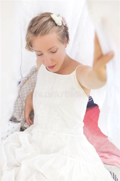 Cute Happy Caucasian Woman With Short Haircut In White Dress In Stock