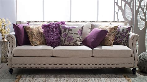 5 Ways To Decorate A Neutral Sofa With Throw Pillows Hayneedle Purple Sofa Cushions On Sofa