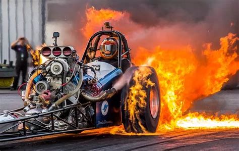 Fearless Racing Driver Flicks V For Victory Sign As High Speed Dragster