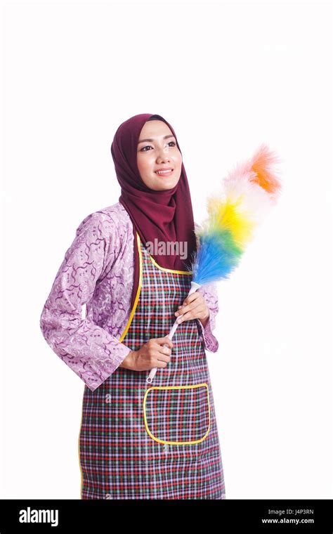 Portrait Of Housewife Wearing An Apron And Hold A Cleaning Tool Isolated On White Background