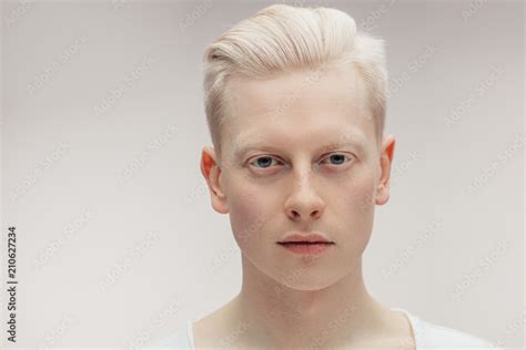 Fashion albino model man portrait isolated on white background. Stylish ...