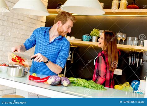 Young Couple Preparing Healthy Meal In The Kitchen Stock Image Image