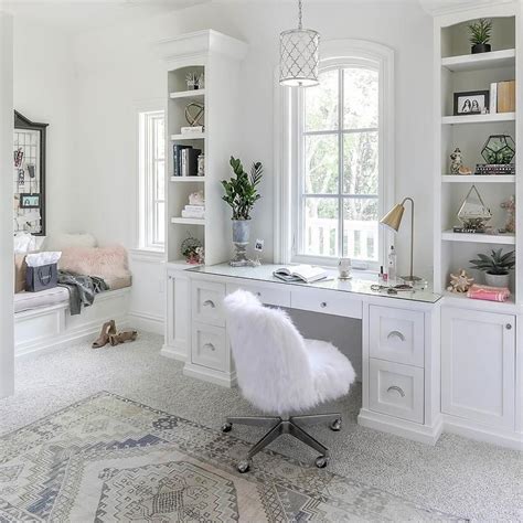 Gorgeous bedroom built-in desk and shelves designed under a window and ...