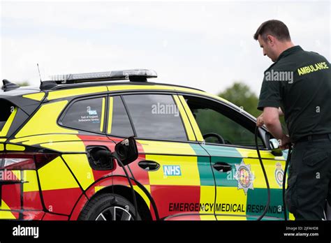 A Paramedic Charges One Of The New Electric Rapid Response Vehicles