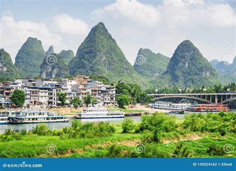 View of Yangshuo Town, Amazing Bridge and Scenic Karst Mountains Stock ...