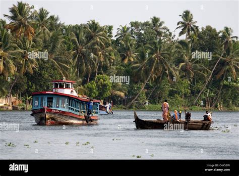 Ferry And Canoes In The Backwaters Of Alleppey Alappuzha Kerala India