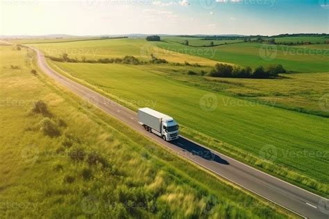 Big Blue Truck Driving Fast With A White Trailer With Blank Space For