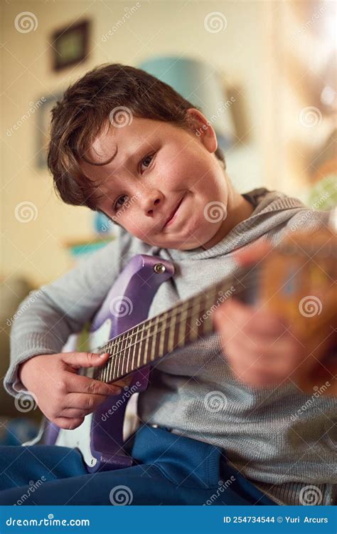 Hes A Talented Young Musician Portrait Of A Little Boy Playing An