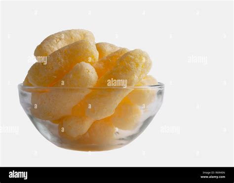 Corn Puffs In A Glass Bowl Isolated On White Background Crunchy