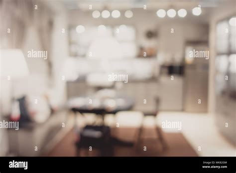 Blurred Background Modern Kitchen And Dinning Room In House With Bokeh