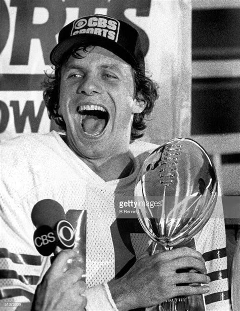 Quarterback Joe Montana Of The San Francisco 49ers Holds The Vince