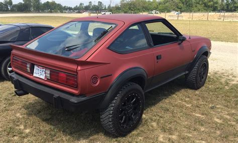 An Off Road Sports Carbehold The Wheel Drive Amc Eagle Sx