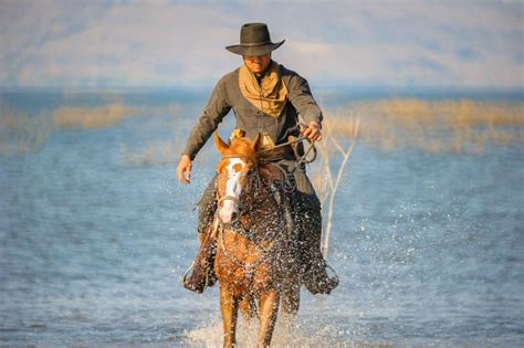 Western Cowboys Riding Horses are Running at Speed. Stock Image - Image ...