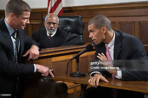 A Lawyer Questioning A Suspect High Res Stock Photo Getty Images