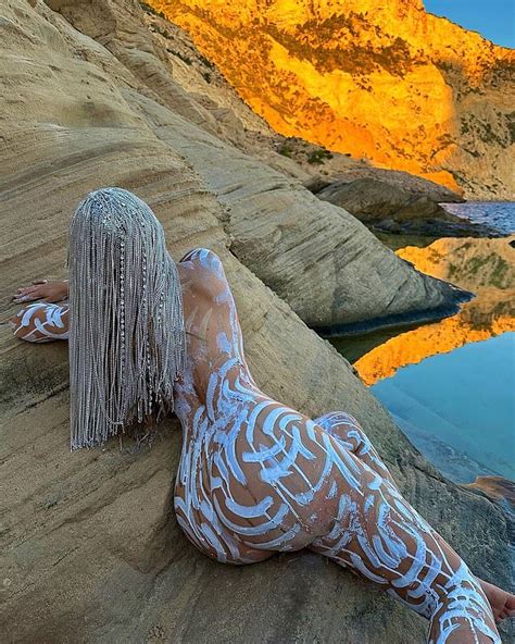 Demi Rose Goes NAKED Beneath Just White Body Paint Before Slipping Into Bejewelled Thong