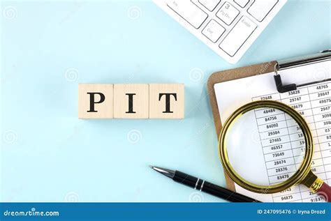 Pit Word On Wooden Cubes On Blue Background With Chart And Keyboard