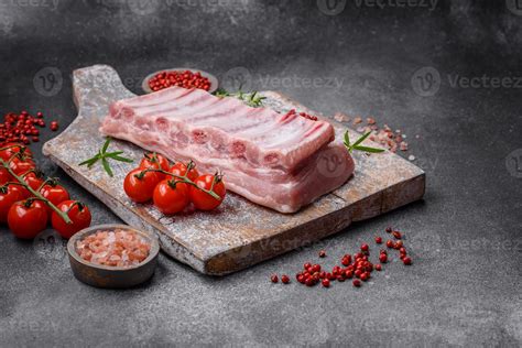 Raw Pork Ribs With Meat With Salt Spices And Herbs 25007224 Stock