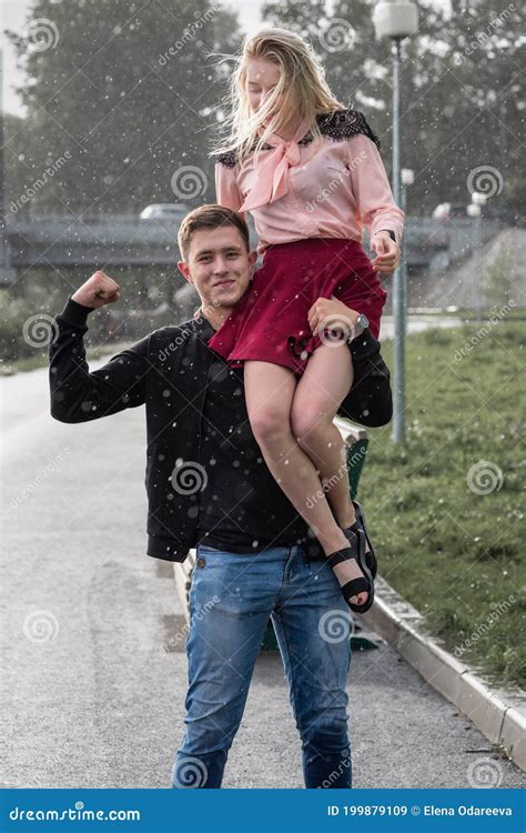 Guy Carrying Girl Over Shoulder