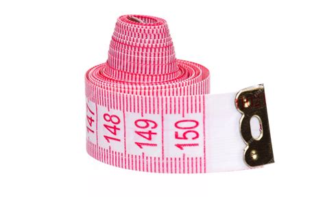 Premium Photo | Measuring tape of the tailor over white background