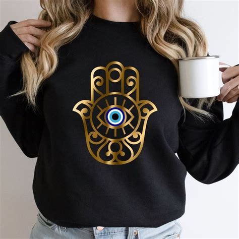 Pin By Maria Soledad Aguilar On Ojo Turco Evil Eye Clothing Hamsa