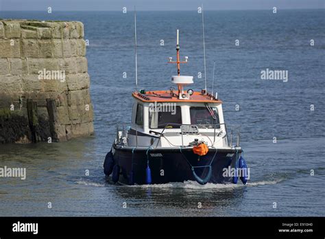 A Boat Enters Seaham Harbour In County Durham England Stock Photo Alamy