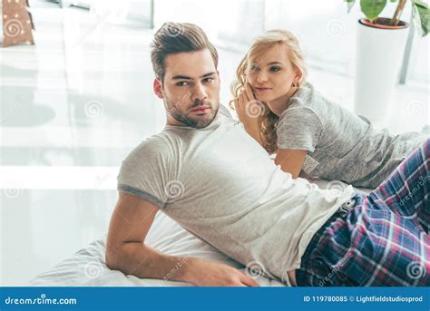 Lying Young Couple In Pajamas Lying Together Stock Image Image Of