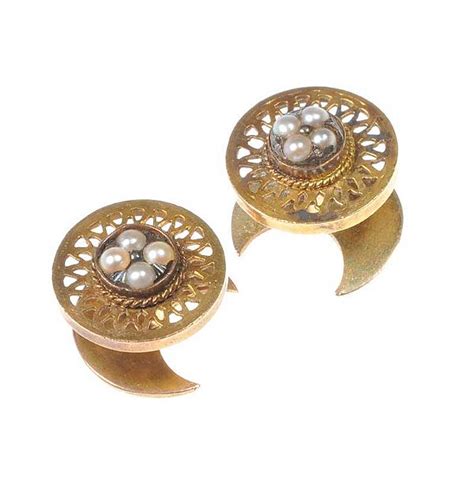 PAIR OF GOLD-TONE METAL STUDS SET WITH SEED PEARLS