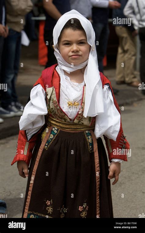 Young Girl Wearing Traditional Costume At Cavalcata Sarda Festival In