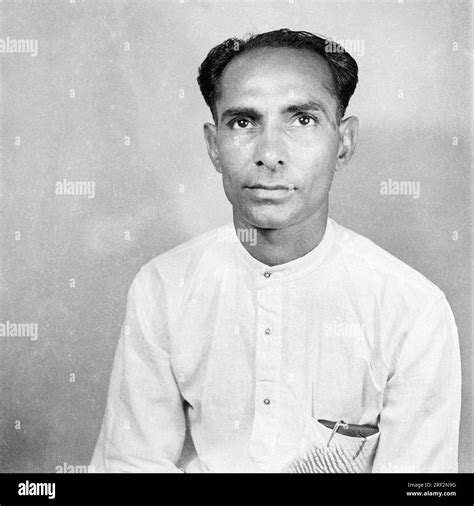 Old Vintage 1900s Black And White Studio Portrait Of Indian Man Wearing