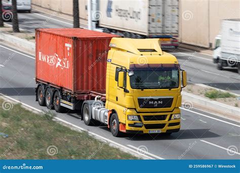 Man Tgx Truck Loading A Red Container Trailer Along Barcelona S Ronda