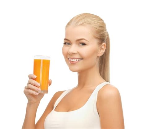 Premium Photo Young Woman Holding Glass Of Orange Juice