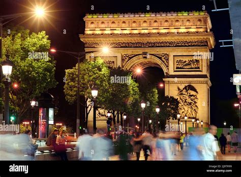 Larc De Triomphe And Lavenue Des Champs Élysées Towards Midnight On A