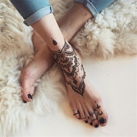 A Person S Feet With Hendix On Them And The Words Explore Written In Arabic