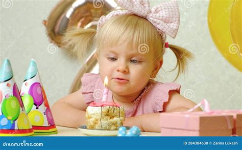 A Two Year Old Girl Blows Out A Candle On A Birthday Cake Makes A Wish Stock Footage Video Of