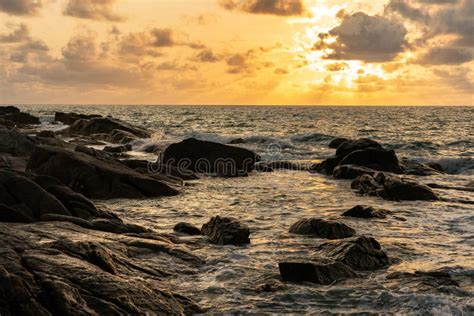 A Beautiful Sunset On The Rocky Beach Stock Photo Image Of Splashing