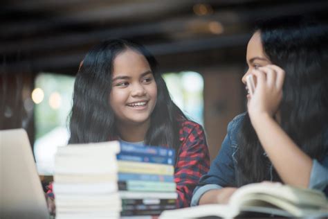 Two happy student friends in a cafe 1996334 Stock Photo at Vecteezy