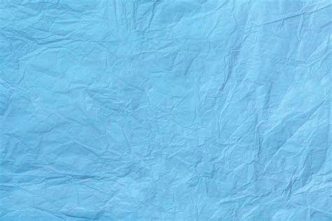 Premium Photo | Texture of crumpled light blue wrapping paper