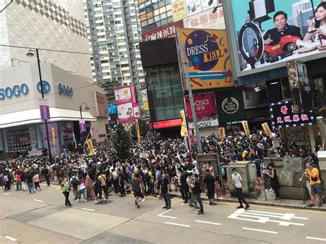 Hong Kong activist arrested as hundreds gather to protest national ...