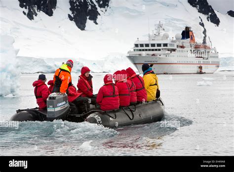 Antarctica Paradise Bay Cruise Ship Passengers In Zodiac Aproaching