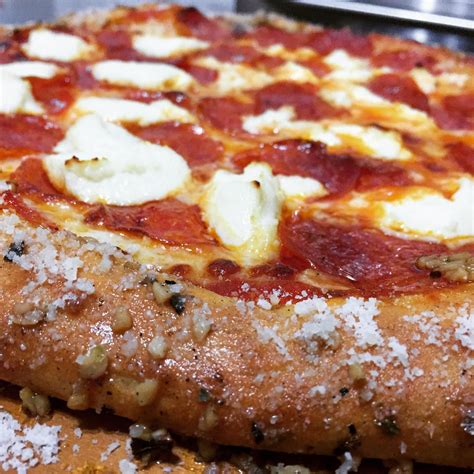 Homemade Pizza With Pepperoni Ricotta And A Garlic Butter Parmesan