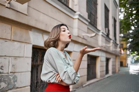 Premium Photo Pretty Woman In Red Skirt On The Street Walk Near The