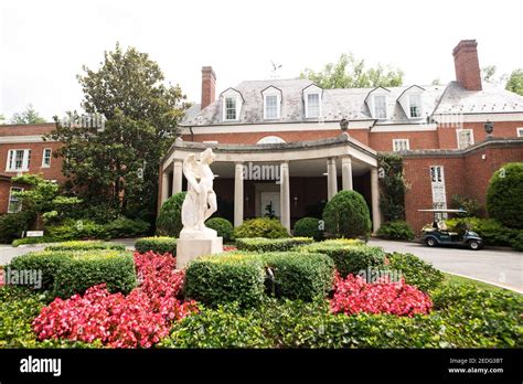 A Statue Of Eros Greets Visitors At The Motor Court Entrance At